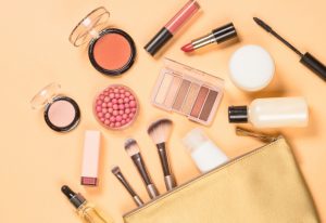 Makeup spilling out of cosmetic bag.