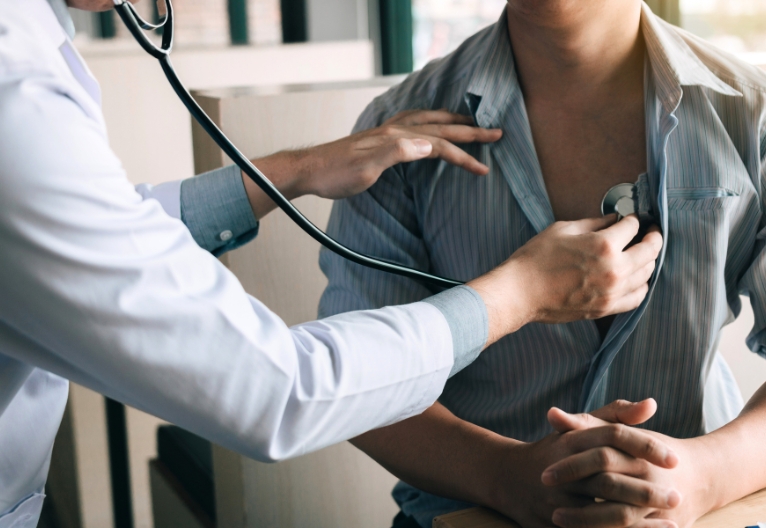 Man having his heart checked by a doctor.