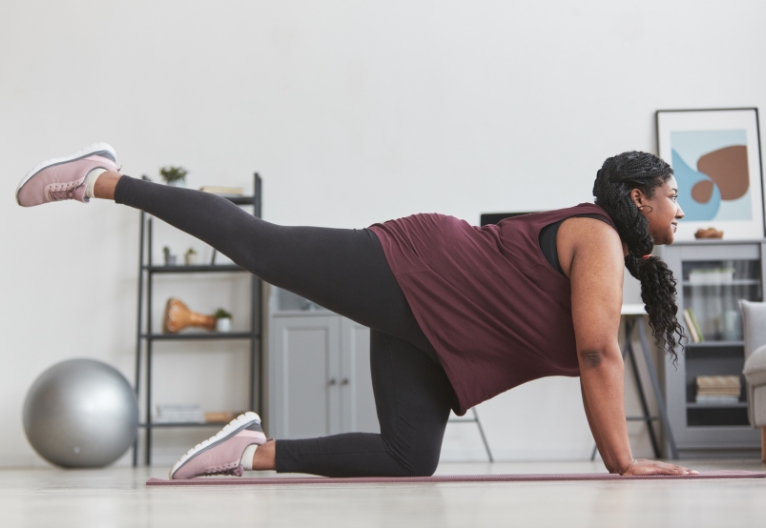 Woman exercising on the floor.