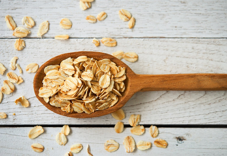 Wooden spoonful of oats.