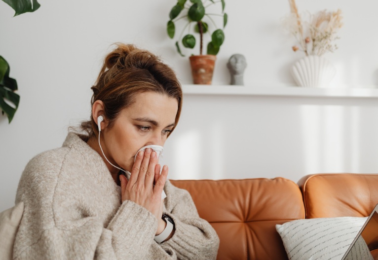 Woman with a runny nose.