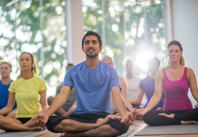 Group of people in a yoga class.