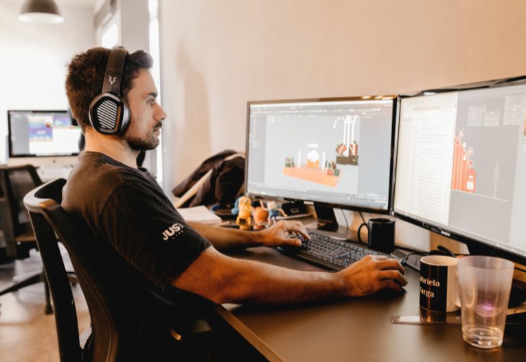 Man sitting at an ergonomic desk.