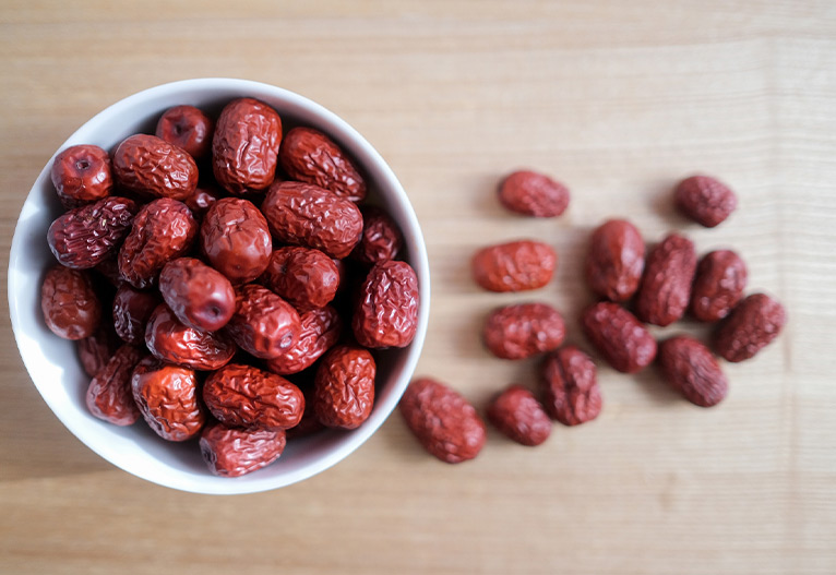 A bowl of red Chinese dates.