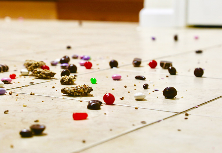 Spilled candy on a floor.