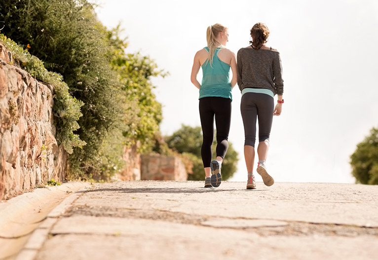 Two woman walking.