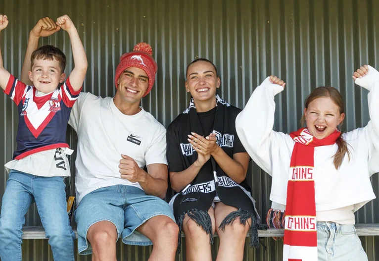 People wearing footy apparel.