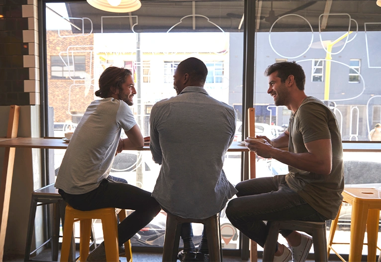 Men socialising in a cafe.